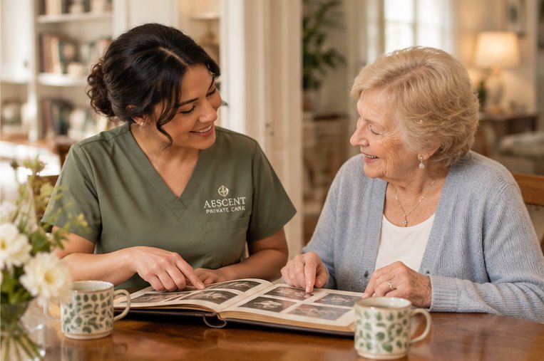 Aescent caregiver and senior client looking through a photo album together.